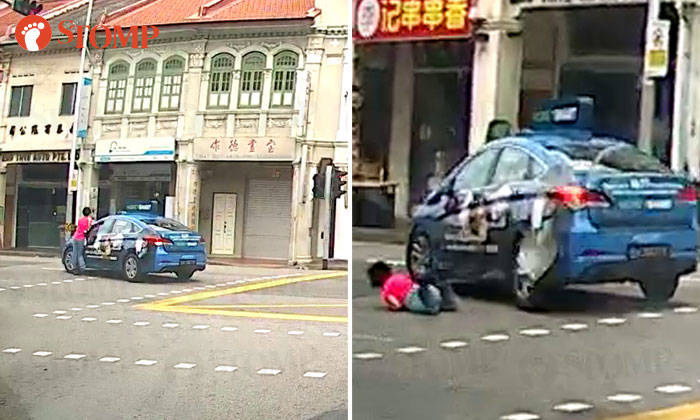 Pedestrian got knocked down by taxi, even though green light in her favour